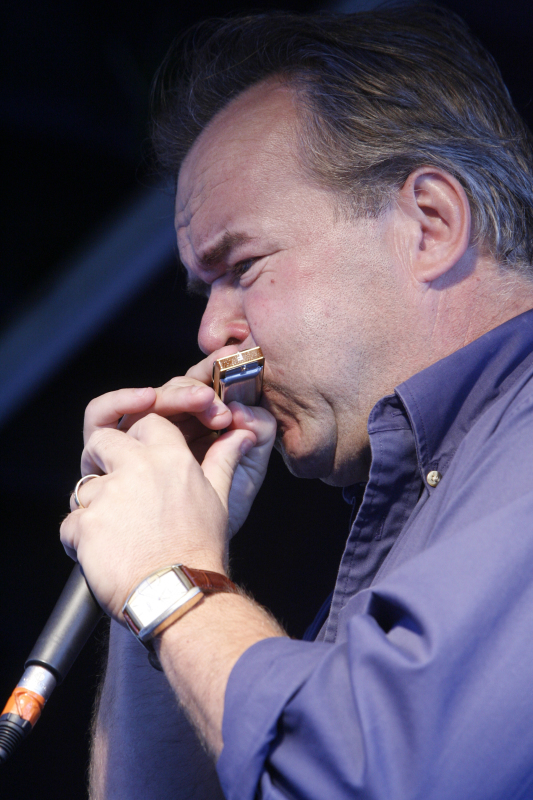 Noel Chenier/Telegraph-Journal Rick Hutchins of the Downtown Blue Band blows on his harmonica at teh Salty Jam Festival