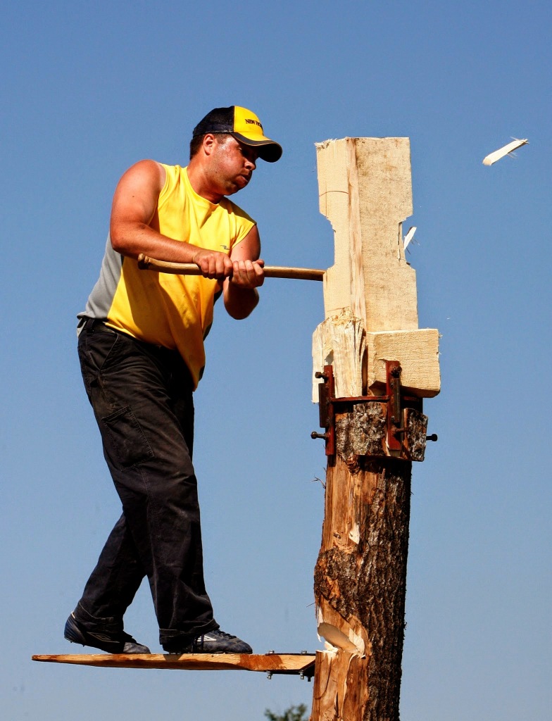 Noel Chenier/Telegraph-Journal Trevor Dillman of Truro, Nova Scotia sends wood chips flying as he competes in the Springboard Chop at the St. Stephen International Lumberjack Championships. Competitors must first chop a hole to support a springboard that