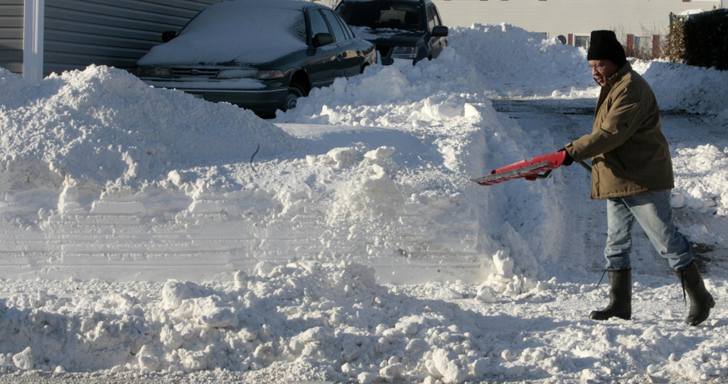 Noel Chenier/Telegraph-Journal Keving Langford tosses a shovel load of snow from the driveway of his North End home on Tuesday as Saint John residents continued to dig out from Monday's snowfall.