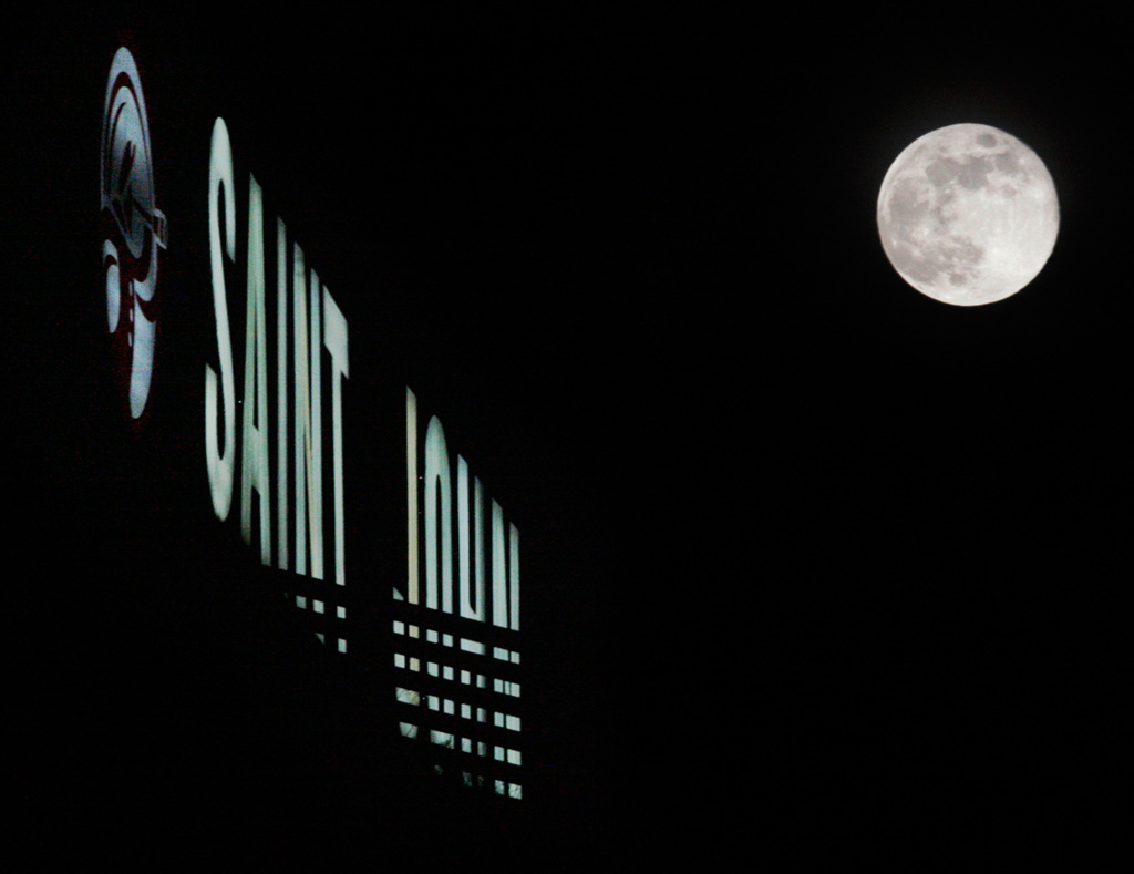 Noel Chenier/Telegraph-Journal The full moon rises above the lit Saint John sign on Fort Howe on Wenesday night