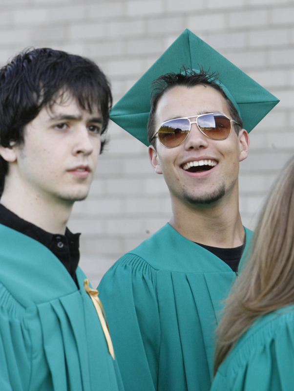 Noel Chenier/Telegraph-Journal Graduates Don Daley and Brendan Cyr call out to a teacher as the Simonds High School graduates line up for the procession to their ceremony.